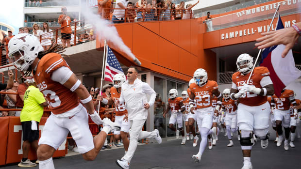 Texas Longhorns head coach Steve Sarkisian and his team run onto the field for the game against the BYU Cougars at Royal-Memorial Stadium on Saturday October 28, 2023. 